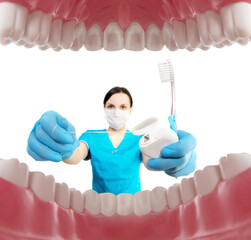 Dentist with tools. Concept of dentistry, whitening, oral hygiene, teeth cleaning with toothbrush, floss. Dentistry, taking care of a beautiful and healthy smile. Dental tooth care clinic. Stomatology