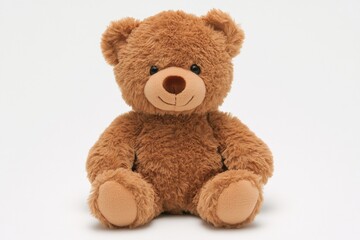 Fototapeta premium Soft teddy bear sits upright with a friendly expression showcasing its cuddly charm and inviting touch