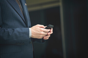 Businessman holding smartphone