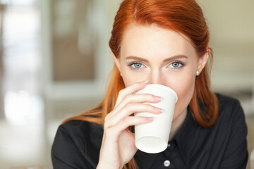 Young businesswoman having a coffee
