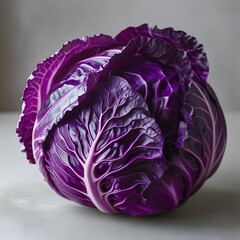 Obraz premium A tightly framed deep purple cabbage, capturing its intricate, crinkled texture, and juicy freshness