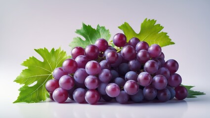 Fototapeta premium Isolated bunch of ripe red grapes with leaves on a white background
