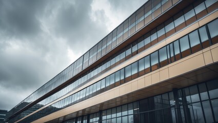 A modern structure features stylish glass windows and metallic details beneath a cloudy sky