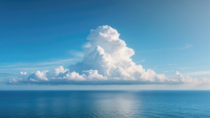 Vast ocean horizon with a large white cloud in a clear blue sky over scenic summer seascape