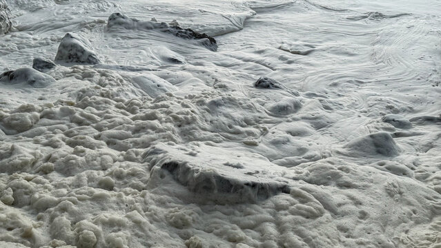 Foamy sea waves crashing over rocky shore, coastal marine nature, summer vacations beach relaxation, dynamic seaside landscape energy