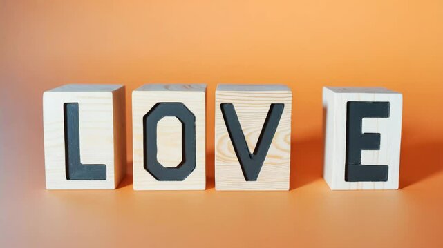 Love Symbol: Wooden Cubes Arranged to Form Love on a Beautiful Table with Copy Space for Theme