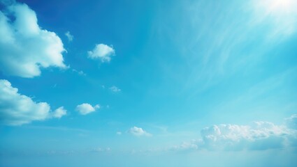 The tranquil bright blue sky features gentle white clouds drifting peacefully under soft sunlight, creating a calming and refreshing ambiance.