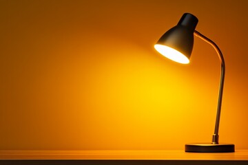 Bright desk lamp casting warm light on a wooden surface in a cozy setting with a vibrant yellow background
