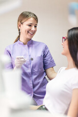 Portraits of doctor and patient in dentist's office. Shallow DOF. Developed from RAW; retouched...