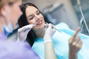 Portraits of doctor and patient in dentist's office. Shallow DOF. Developed from RAW; retouched...
