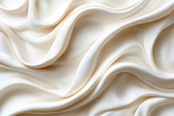 Obraz premium Elegant smooth ivory fabric draped in soft waves, showcasing texture and flow in natural light