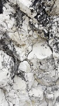 Natural rocky surface with intricate patterns and textures in beige tones, beauty of geological formations