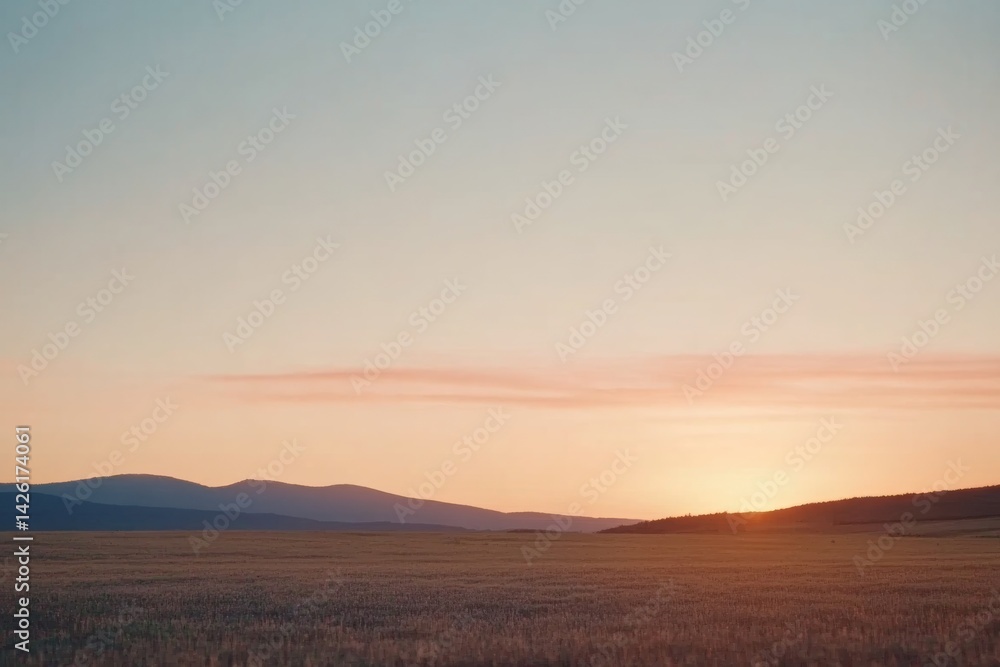 Aufkleber golden hour fills the sky with vibrant hues of orange and pink in an open field, creating a tranquil