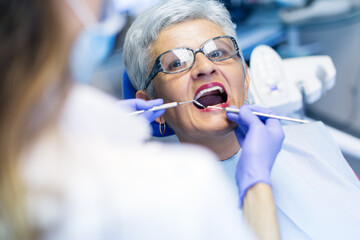 Portraits of patients in dental office having a dental check. Shallow DOF. Developed from RAW;...