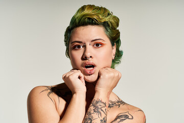 Beautiful woman captures attention with unique style and colorful hair in a polished setting.