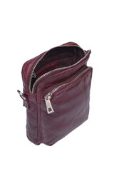 Open maroon leather crossbody bag with silver zippers studio shot . Cut out isolated on white background
