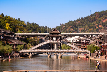 Fenghuang ancient town, China. Traditional chinese wooden houses in old watertown