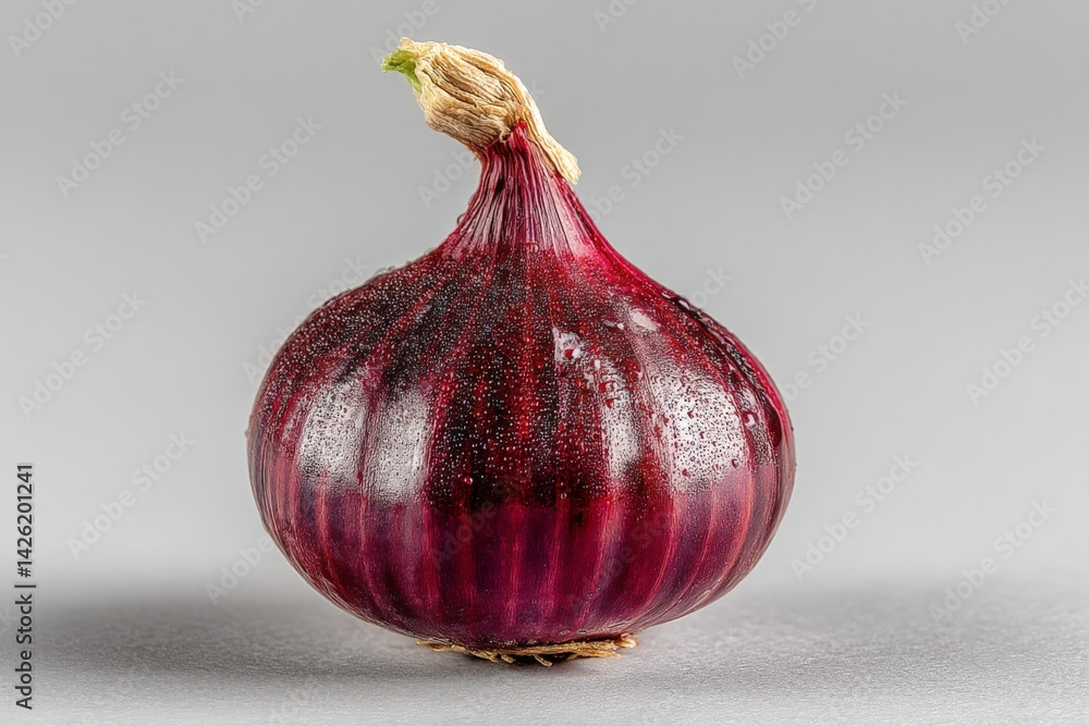 Poster red onion displayed on a gray background, showcasing fresh texture and vibrant color