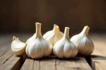 Aromatic Bulbs of Garlic Resting on Rustic Wooden Surface in Soft Light