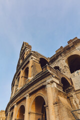 Fototapeta premium Panoramic view of old Colosseum in Rome. Beautiful popular of ancient landmark. Famous card of city of Rome, Italy