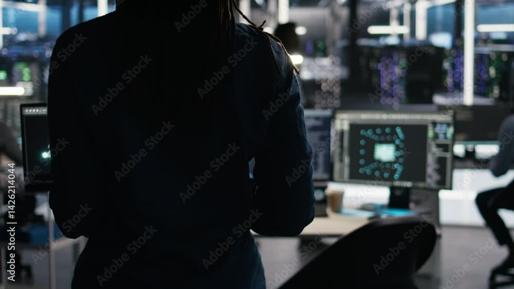 Poster server hub technician arriving in office, using ai visualization insights on pc to optimize system h