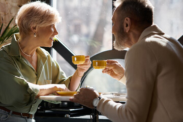 Romantic moments shared over coffee between a mature couple in a cozy cafe