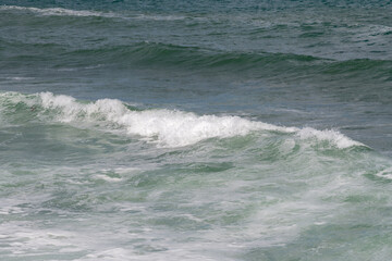 Gentle waves rolling on the Black Sea during a summer day of travel