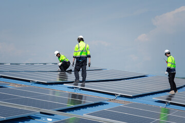 Engineer team installs solar cells check installation solar cell on the roof Sustainable energy industry concept Renewable energy solutions for climate change.. © golfloiloi