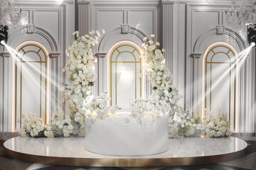 Decor in the restaurant at the wedding is made of white flowers, pearl beads and white columns.