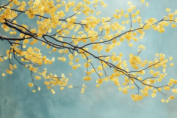 Bright yellow blossoms bloom on branches against a soft blue background in springtime serenity
