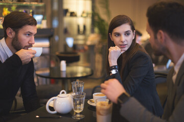 Young businesspeople working in restaurant
