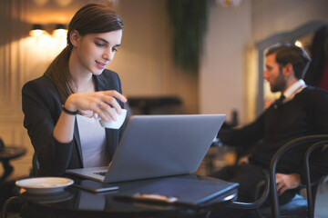 Young businesswoman working in restaurant