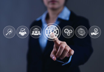 ISO certification and quality assurance standard concept. Businesswoman pointing at ISO...