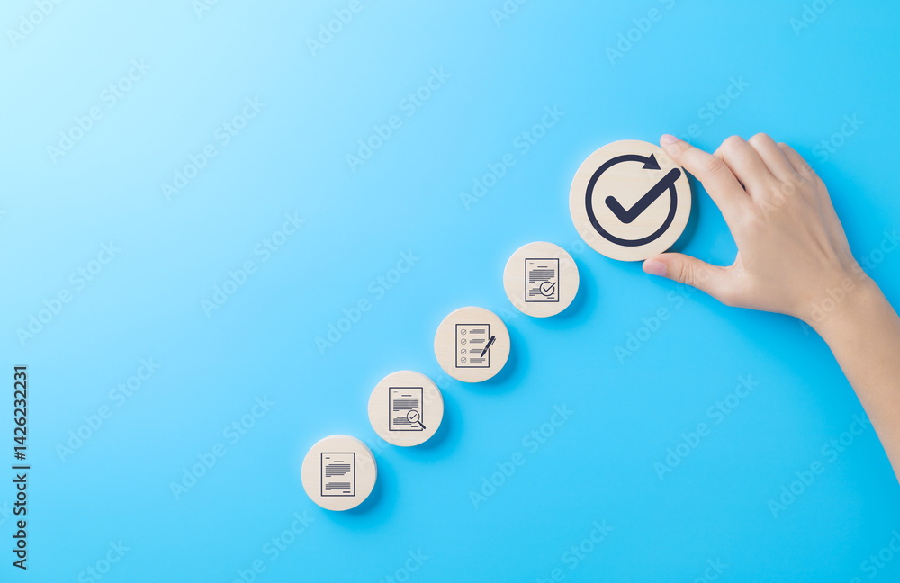 Fototapete quality control and certification process concept. a hand places wooden block with checkmark icon in