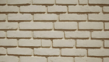Fototapeta premium Beige brick wall with rough texture and natural imperfections, ideal for warm, rustic, or vintage-themed backgrounds.