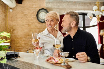 Romantic evening at a charming restaurant for a mature couple enjoying fine cuisine