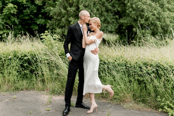 Young attractive couple hugging in nature
