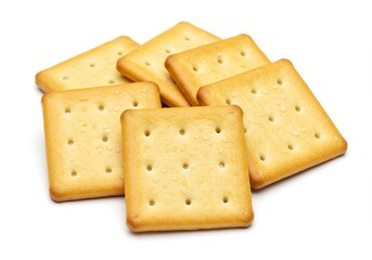 Fototapeta premium Square salted crackers with golden hue and flaky texture casually arranged on white surface for snack representation