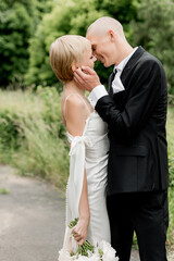Young attractive couple hugging in nature