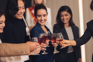 Christmas Day Businessman and business partners are successful, fun and happy at a group celebration party.	
