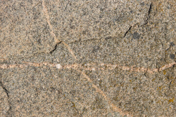 Close-Up of Natural Textured Surface of a Brownish Granite Rock