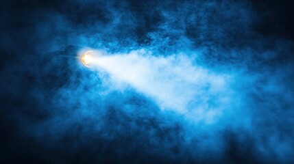 Obraz premium Nighttime spotlight beam through smoky clouds