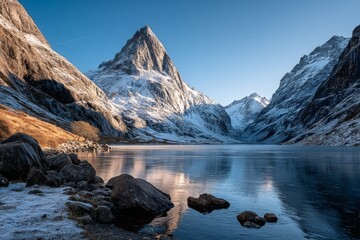 Majestic mountain landscape reflecting on serene lake at sunrise in a peaceful valley