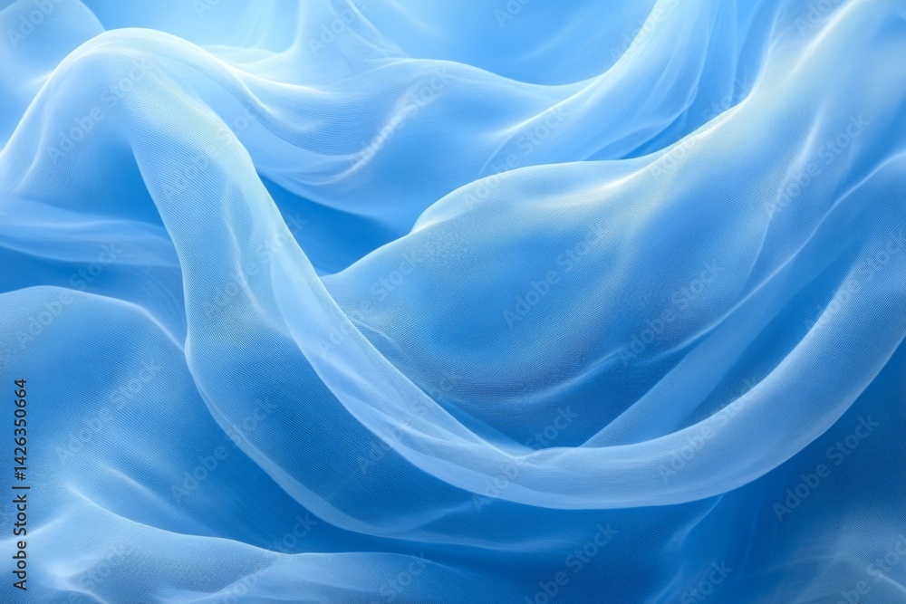Leinwandbilder Soft blue fabric flows elegantly, creating gentle waves in a tranquil setting under natural light