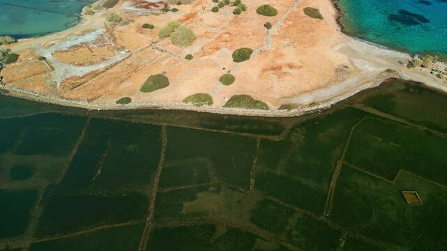 Clear turquoise water revealing underwater ruins of the ancient Dorian city Olous.