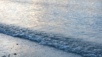 Sea wave on beach in the morning