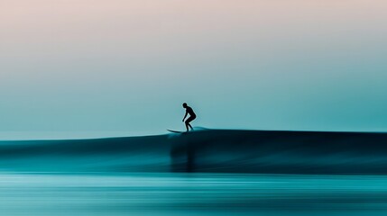 Fototapeta premium Silhouetted Surfer Riding Smooth Pastel-Toned Ocean Wave