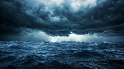 Dramatic ocean scene under a stormy sky with dark clouds and sun rays breaking through.