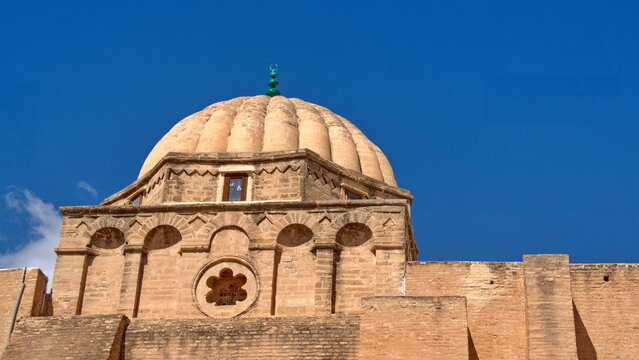 Stone dome above massive stone walls in the Great Mosque of Kairouan in Kairouan, Tunisia