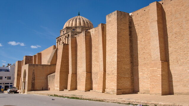 Stone dome above massive stone walls in the Great Mosque of Kairouan in Kairouan, Tunisia